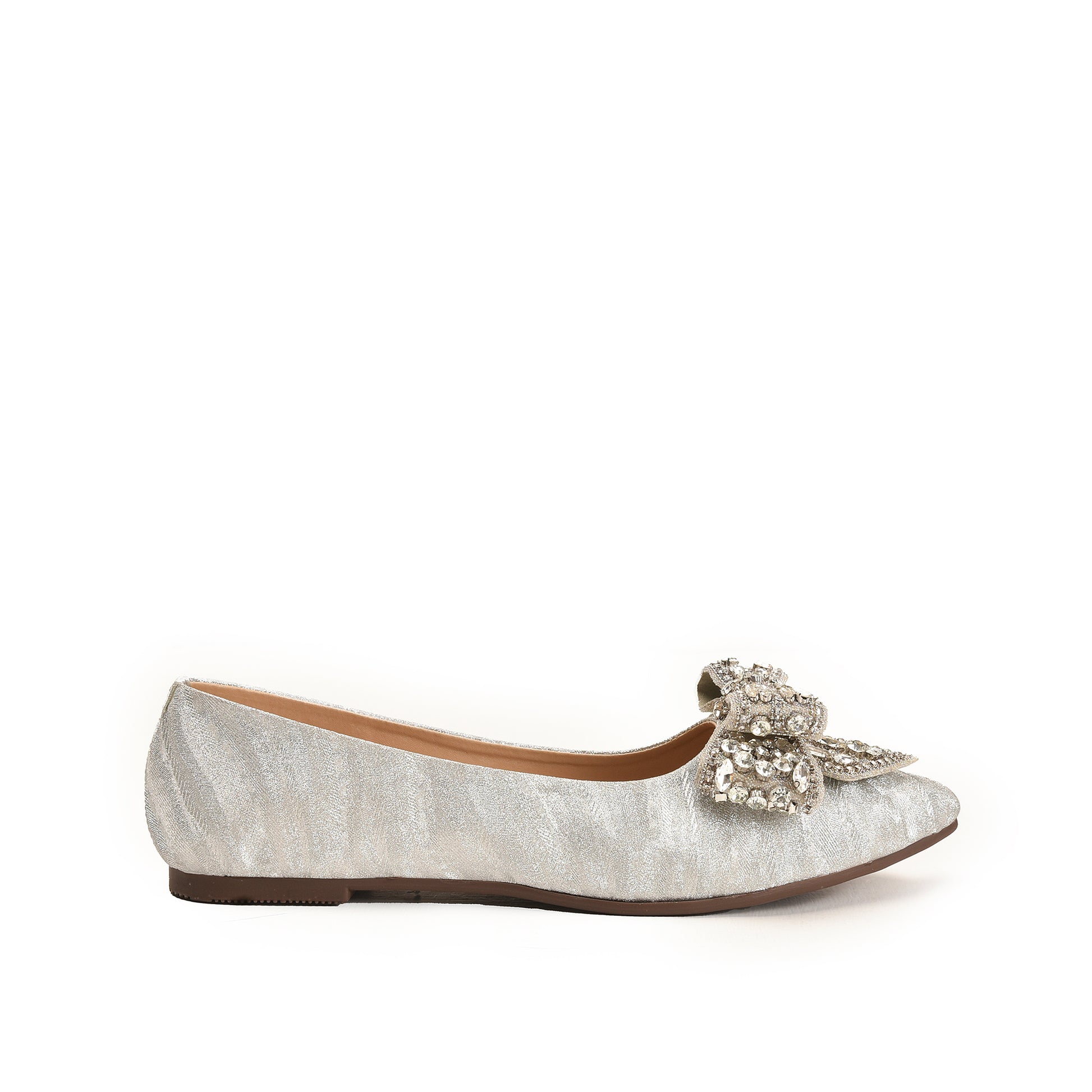 A silver-colored, suede pump with a decorative heel and a bow on the vamp.